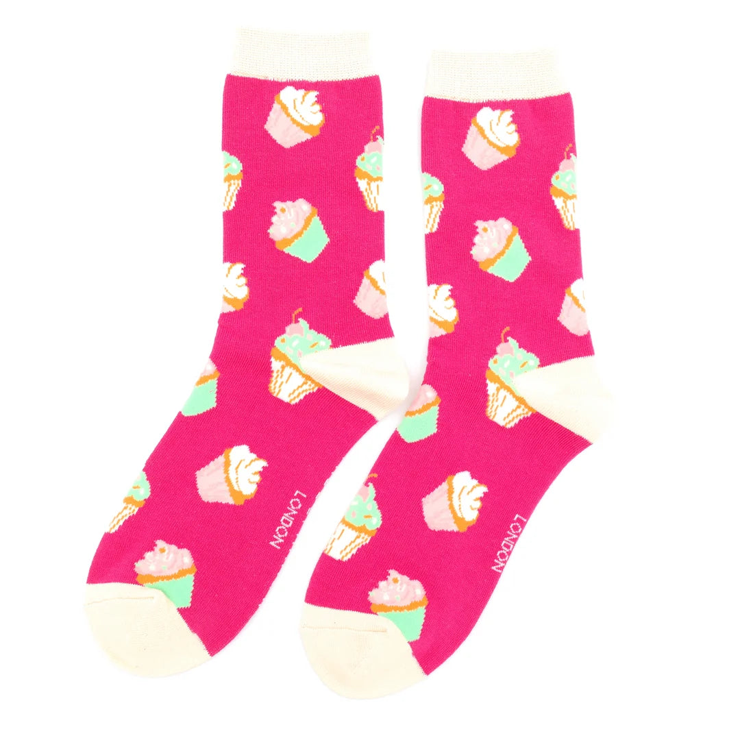 Pink socks with cupcake pattern on a white background