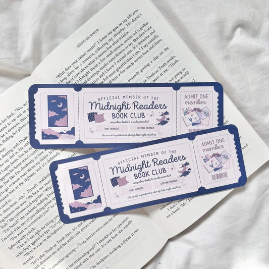 Two 'Midnight Readers Book Club' membership cards on a book page.
