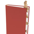 Red book with gold decorative elements on a white background