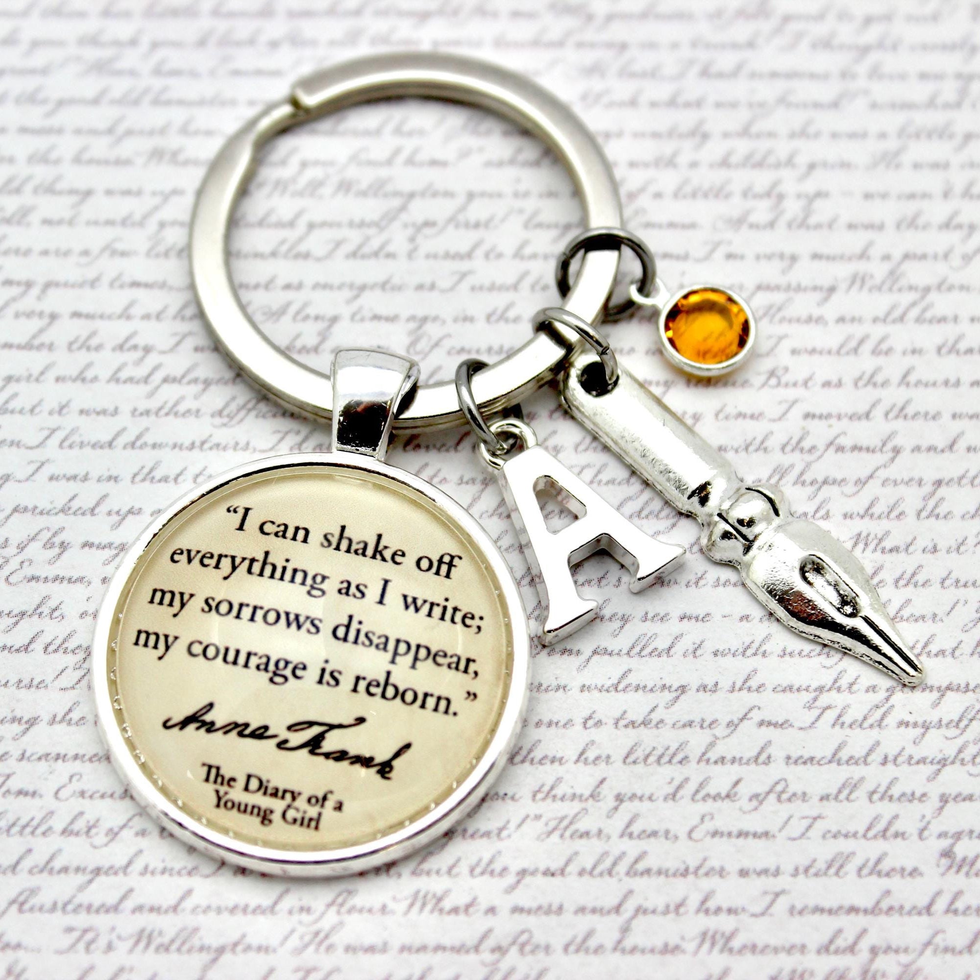 Keychain with Anne Frank as i write quote 
