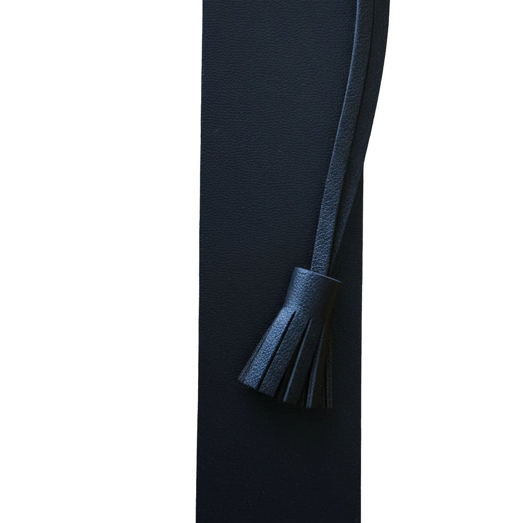 Black leather belt with a tassel on a white background
