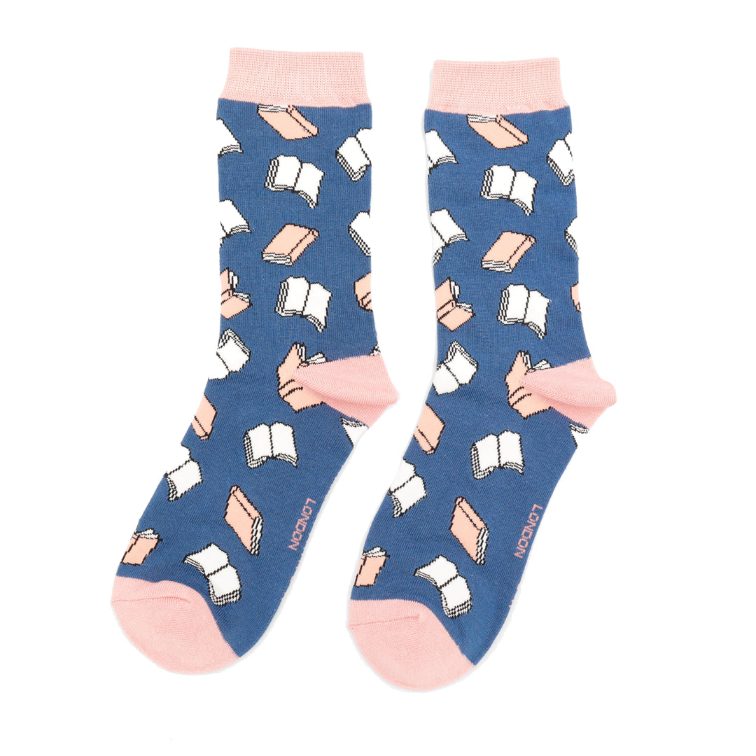 Blue socks with book and hand pattern on a white background