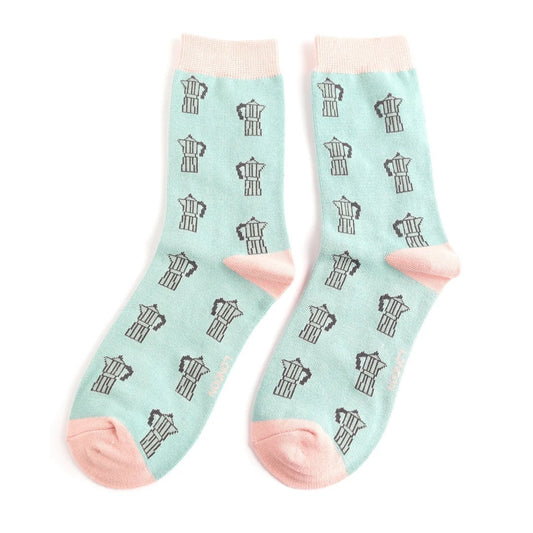 Light blue socks with black coffee pot pattern on a white background
