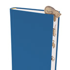 Blue book with a cat-themed bookmark on a white background