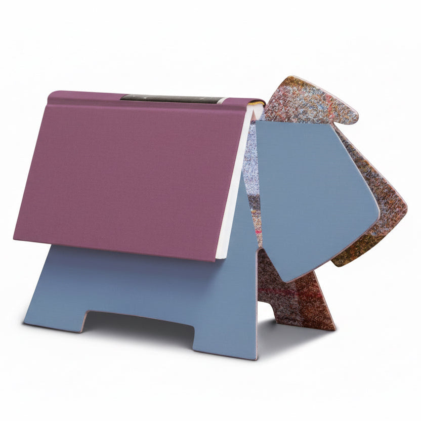 Colorful bookend with a purple base and multicolored top on a white background