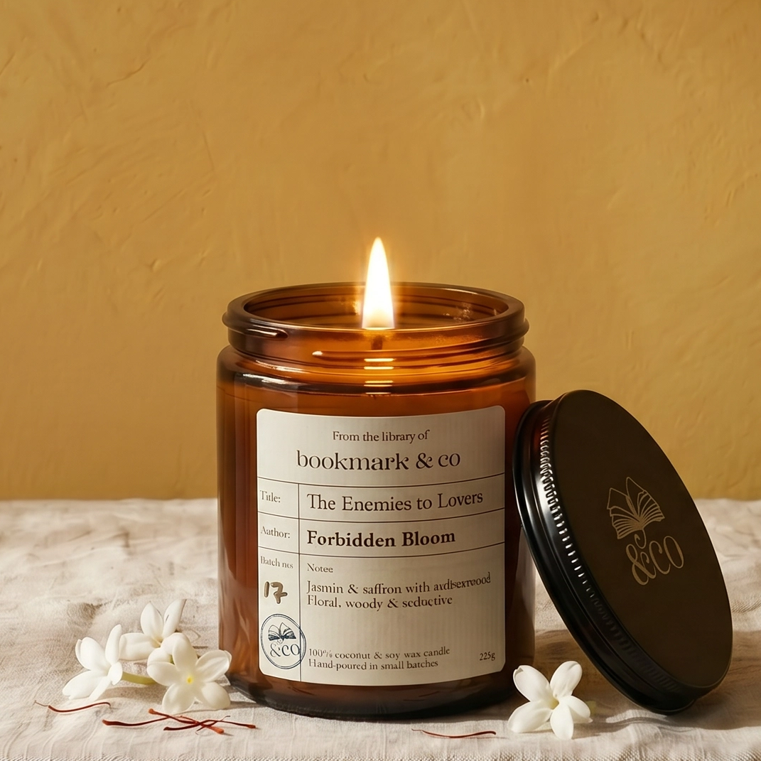 Candle in a glass jar with a label on a textured surface against a yellow wall