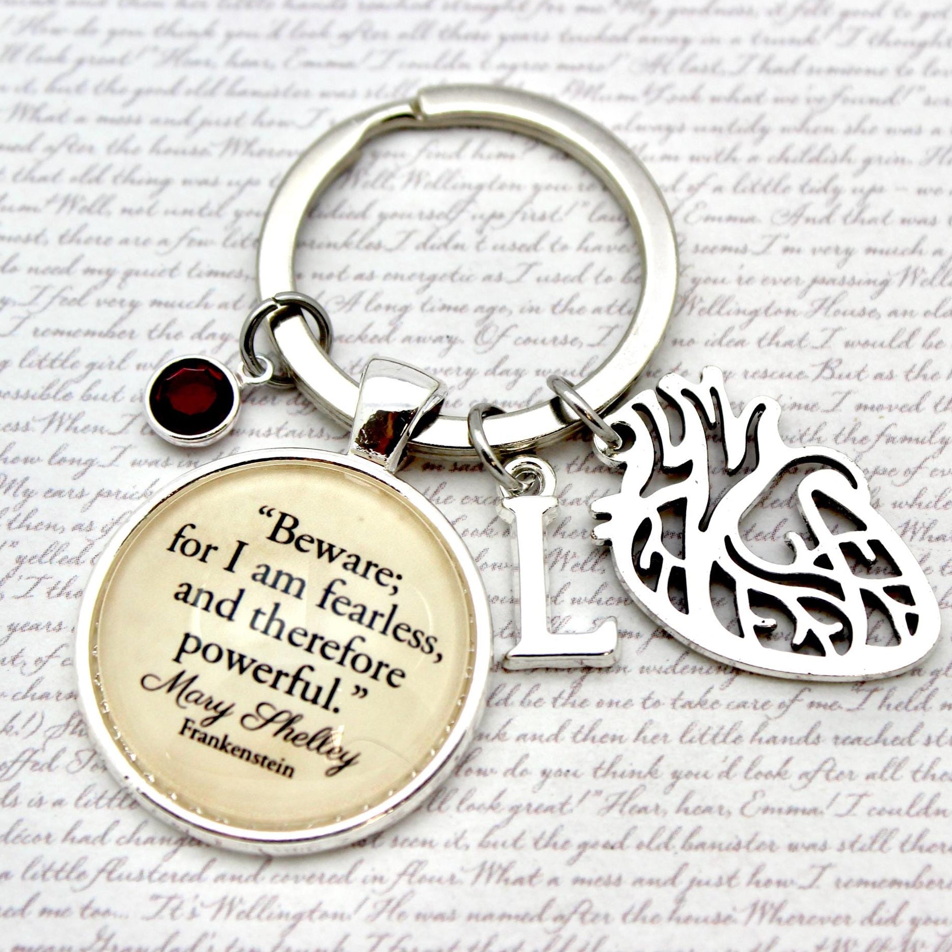 Keychain with motivational quote and heart design on a textured background