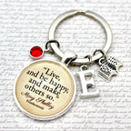 Keychain with motivational quote on a decorative background