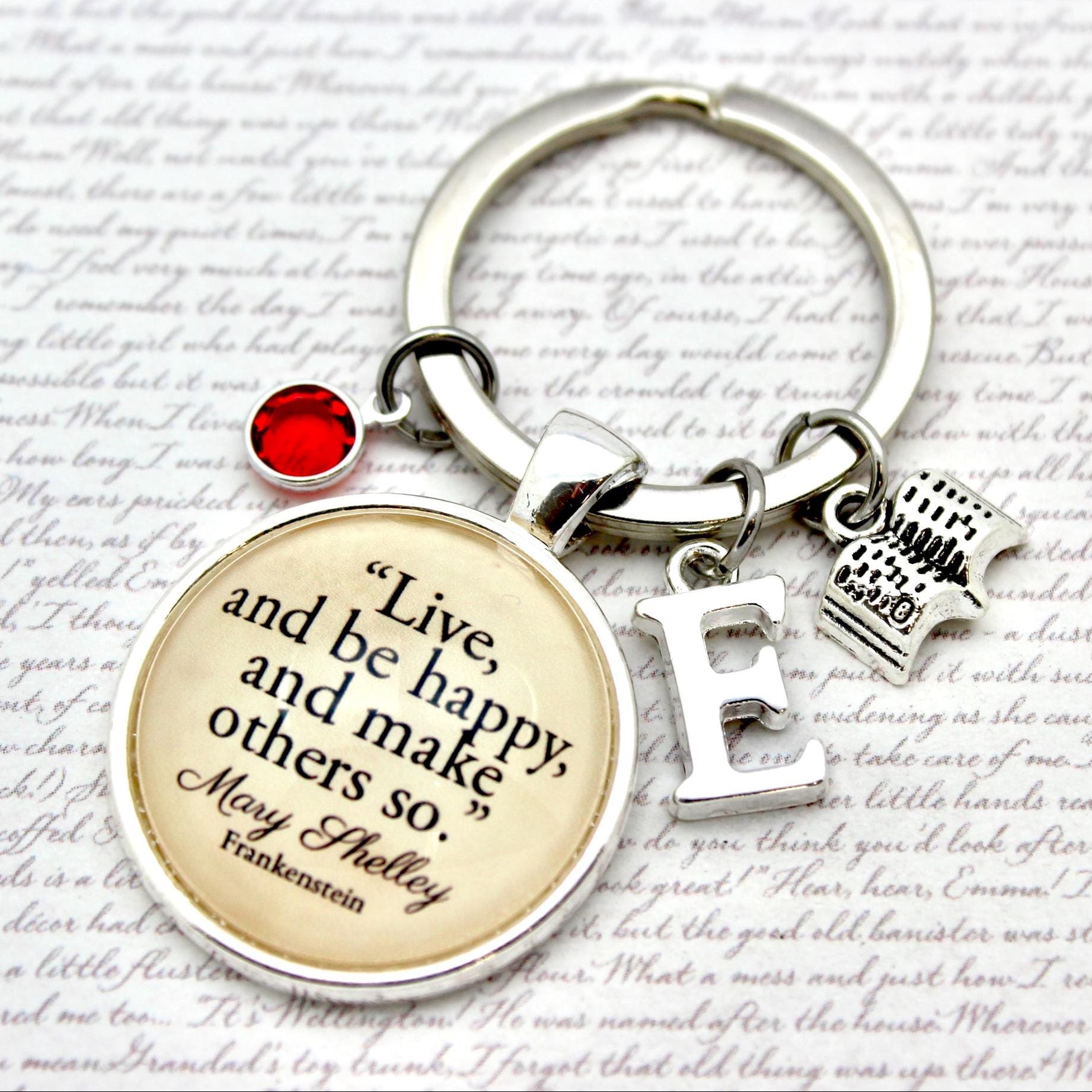 Keychain with motivational quote on a decorative background