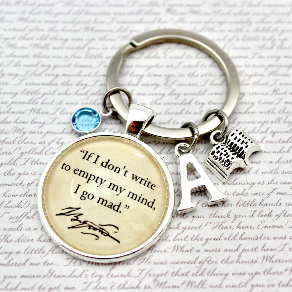 Keychain with Poe quote and letter 'A' on a textured background