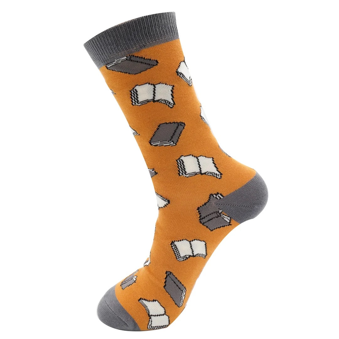 Mustard sock with book pattern on a white background