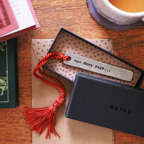 Pewter 'One more page' bookmark in packaging | Bookmark & Co