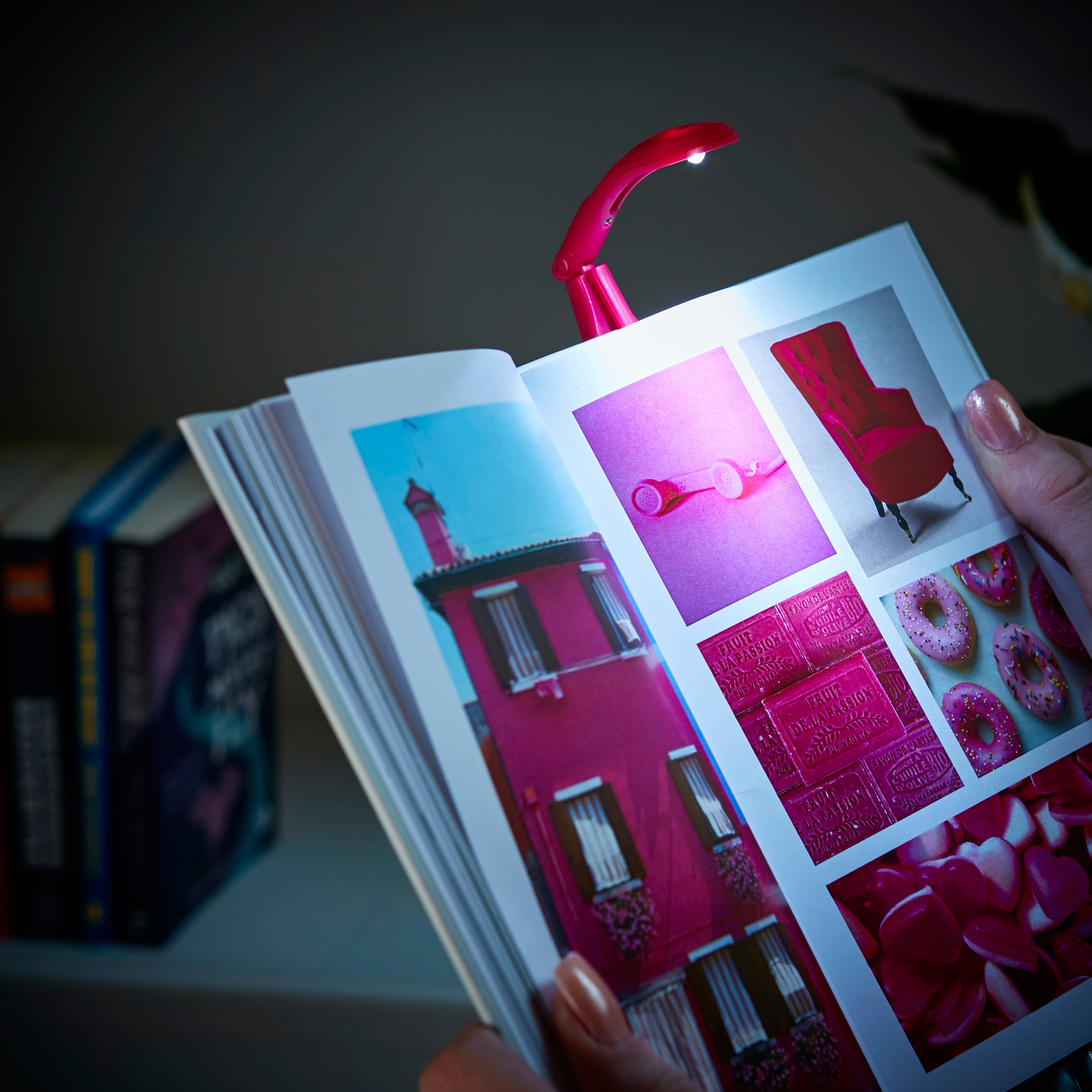 Really Tiny Book Light Pink lit up on a book