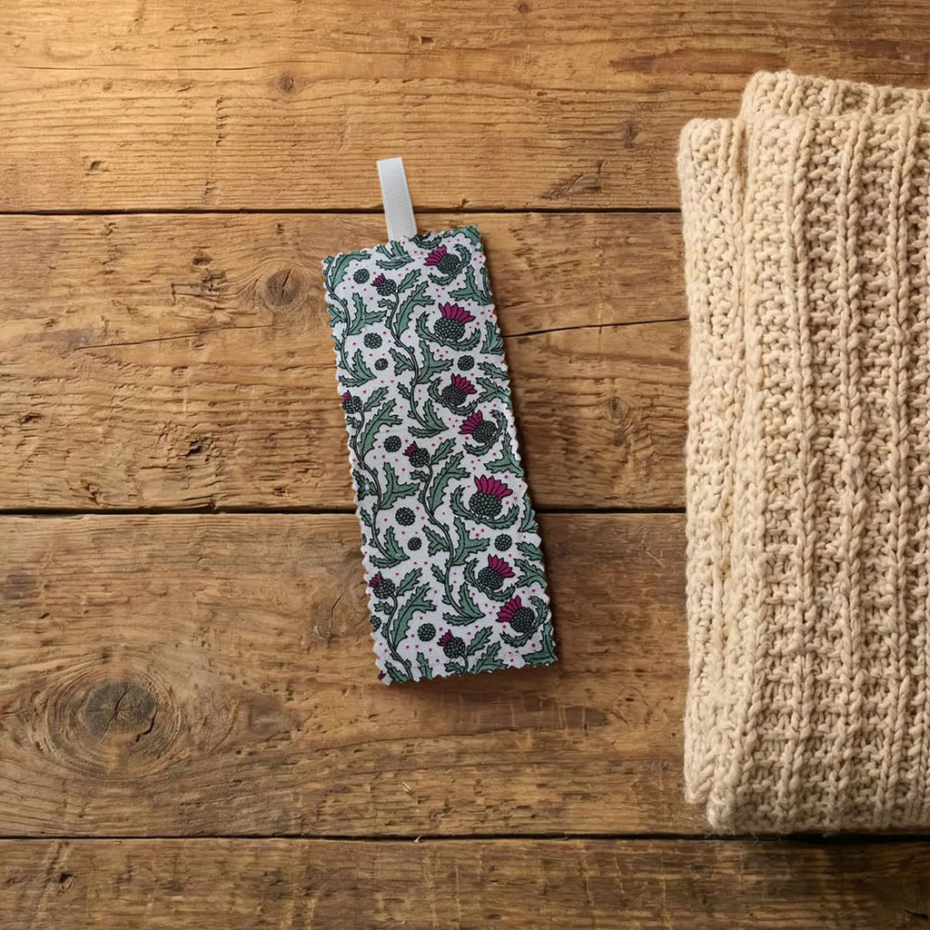 Scottish thistle fabric bookmark on a wooden surface | Bookmark & Co