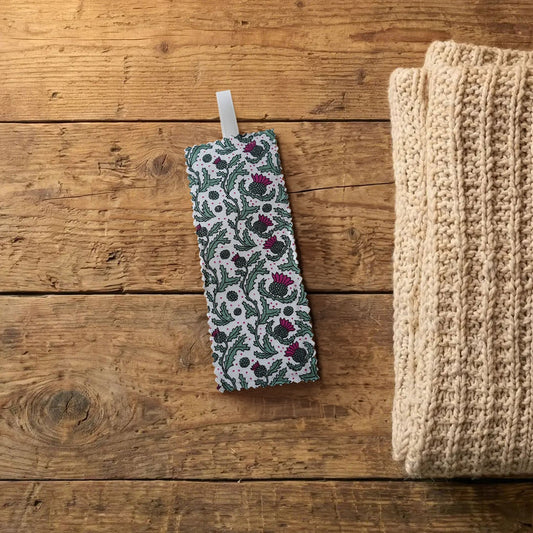 Scottish thistle fabric bookmark on a wooden surface | Bookmark & Co