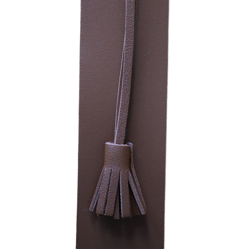 Tan brown bookmark with a tassel on a white background