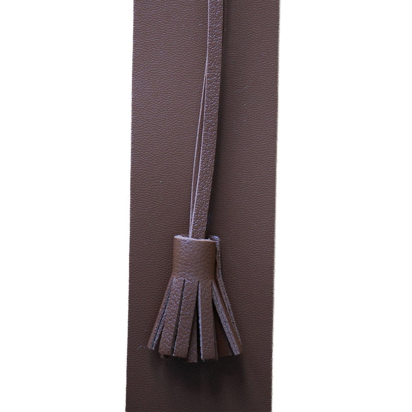 Tan brown bookmark with a tassel on a white background