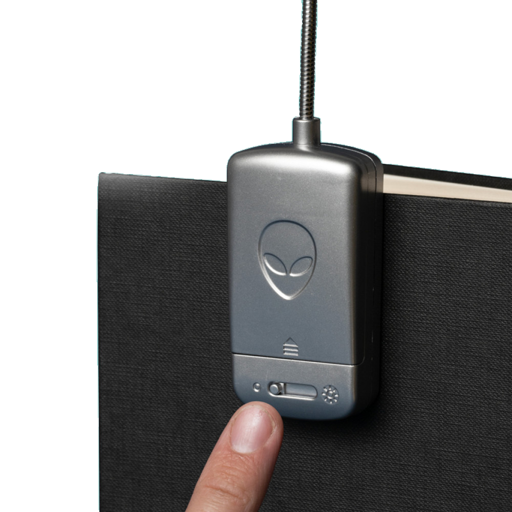 UFO booklight clipped to a book