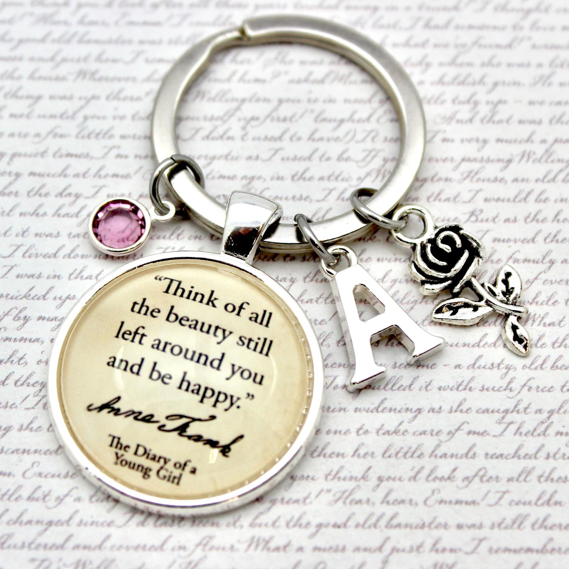 Keychain with motivational quote on a decorative background