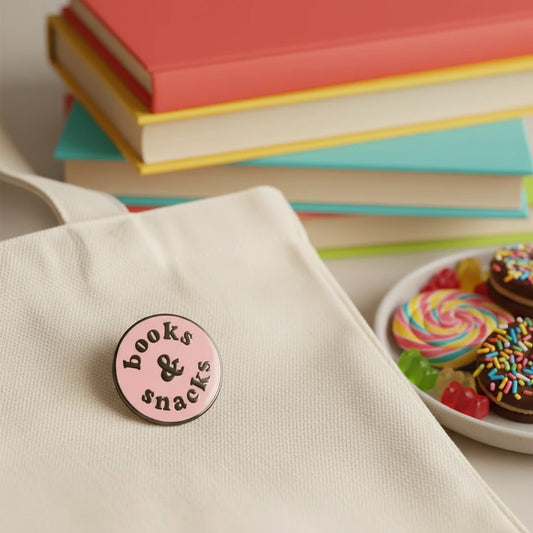 Circular pink badge with 'books & snacks' text on a blue textured background