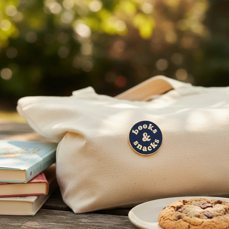 Pin with 'books & snacks' text on outdoor background