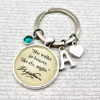 Keychain with engraved quote and letter 'A' on a textured background