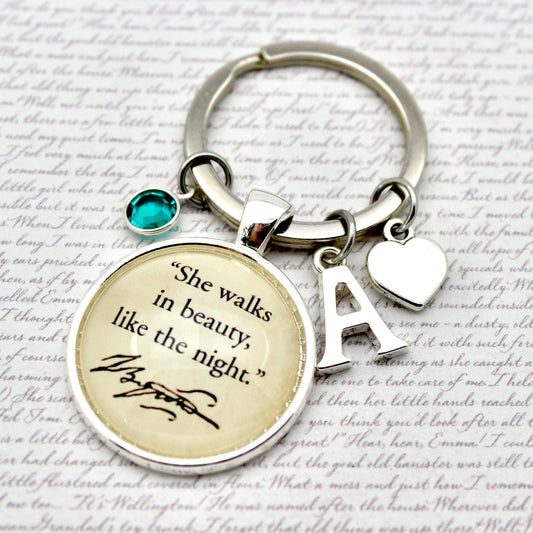 Keychain with engraved quote and letter 'A' on a textured background