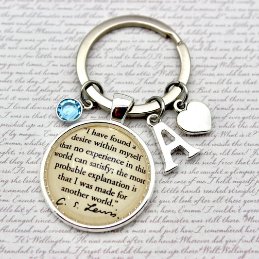Keychain with circular pendant featuring text and initials on a textured background