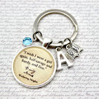 Keychain with quote and charms on a textured background