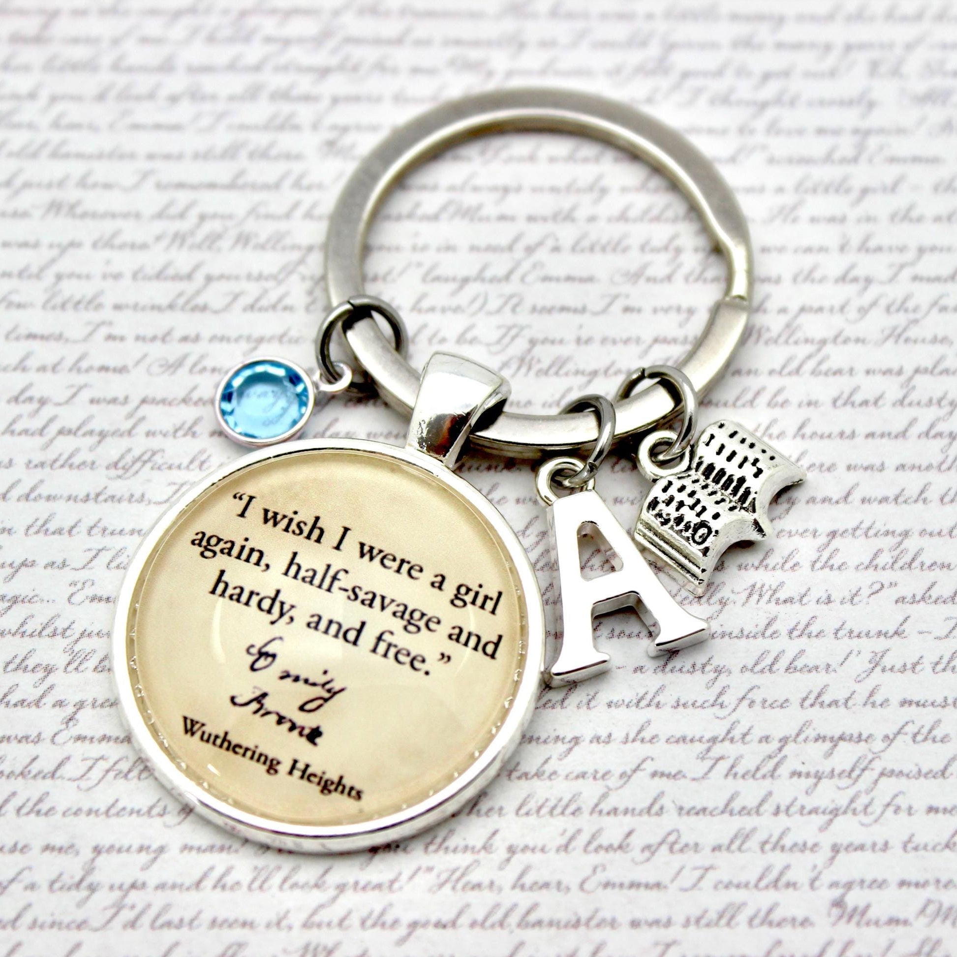 Keychain with quote and charms on a textured background