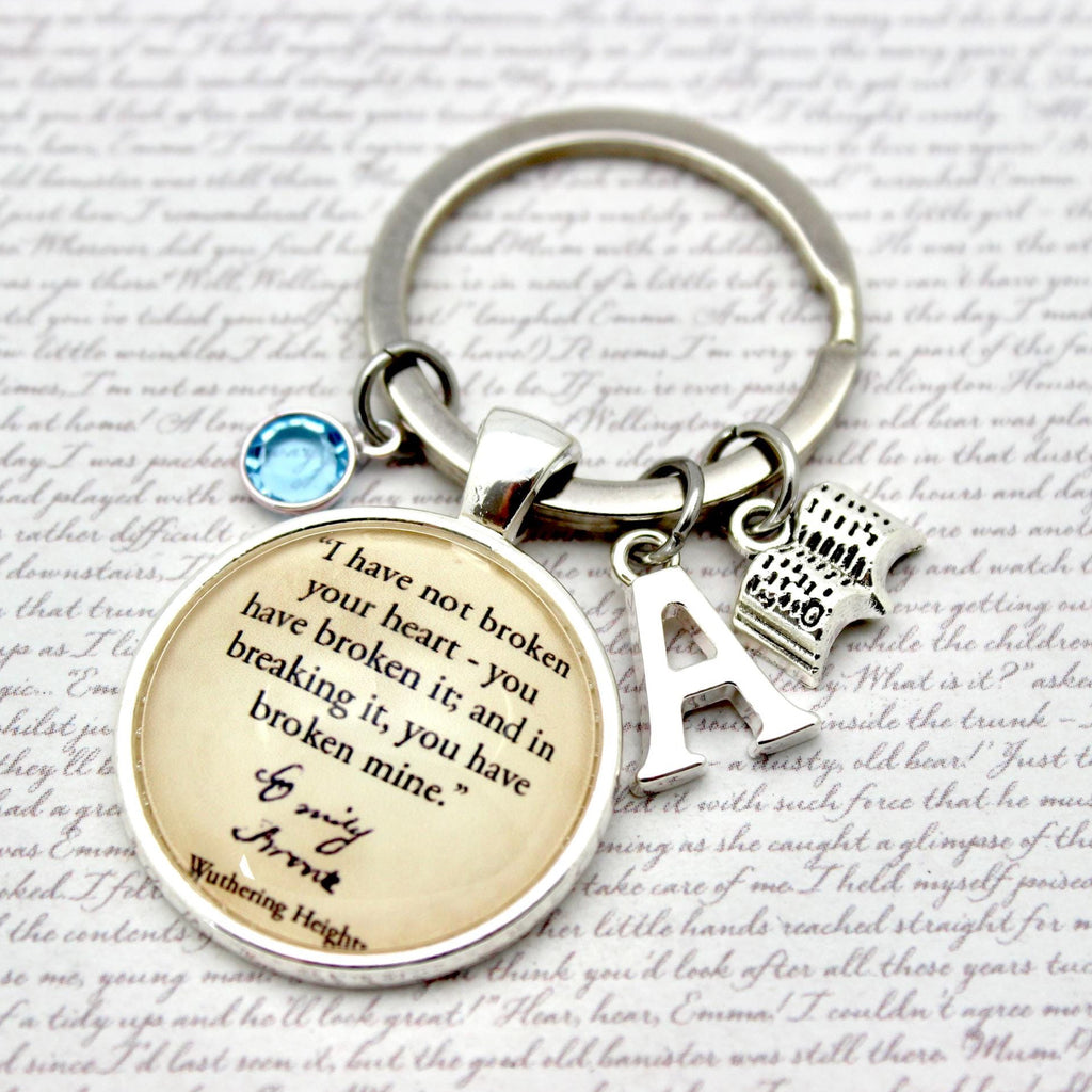 Keychain with circular charm featuring text and letter 'A' on a textured background