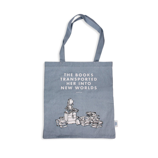 Blue tote bag with text and book illustration on a white background