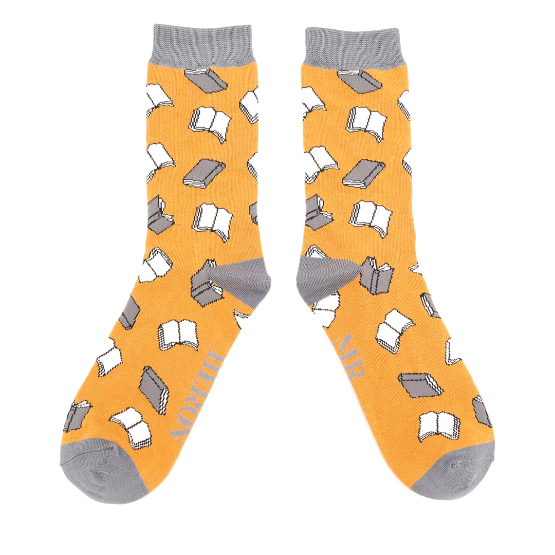 Pair of Mustard socks with book pattern on a white background