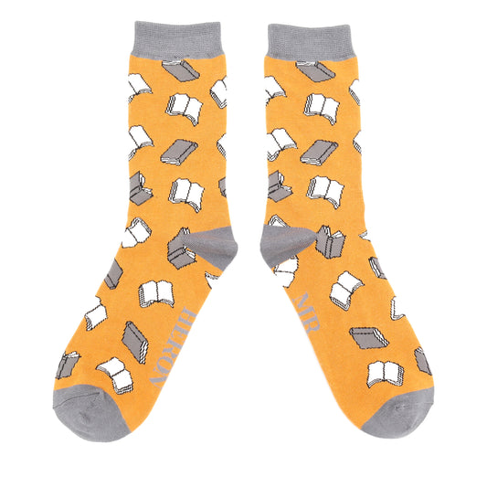 Pair of Mustard socks with book pattern on a white background