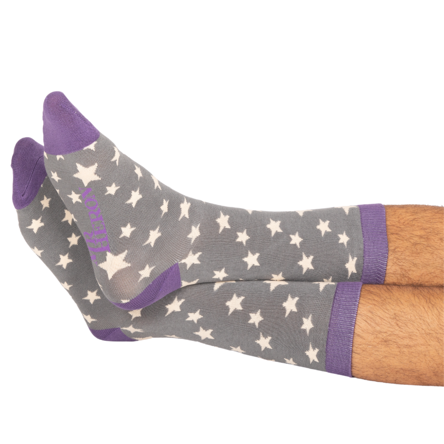 Gray socks with star pattern and purple accents on a white background