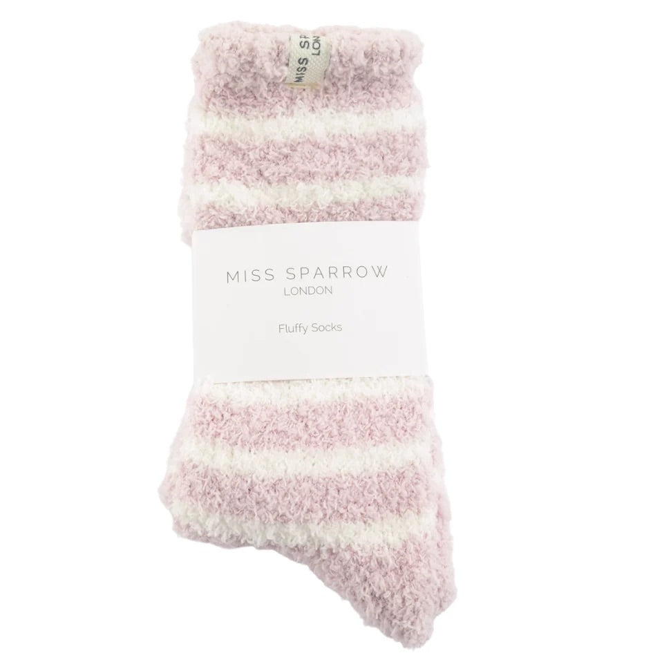 Pink and white fluffy socks with 'Miss Sparrow London' label on a white background