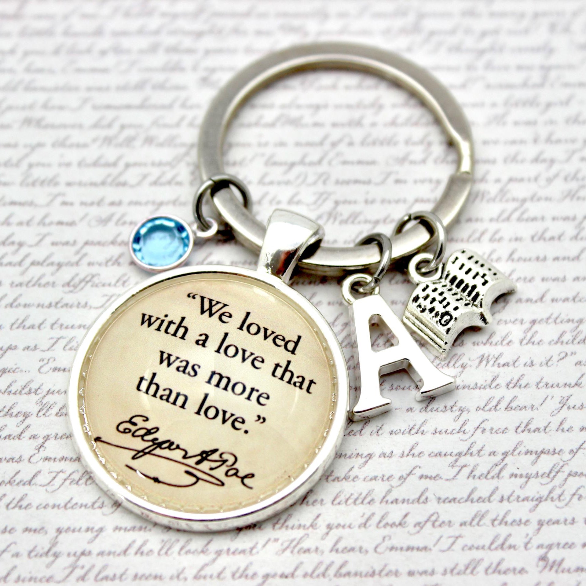 Keychain with engraved quote and letter 'A' on a textured background
