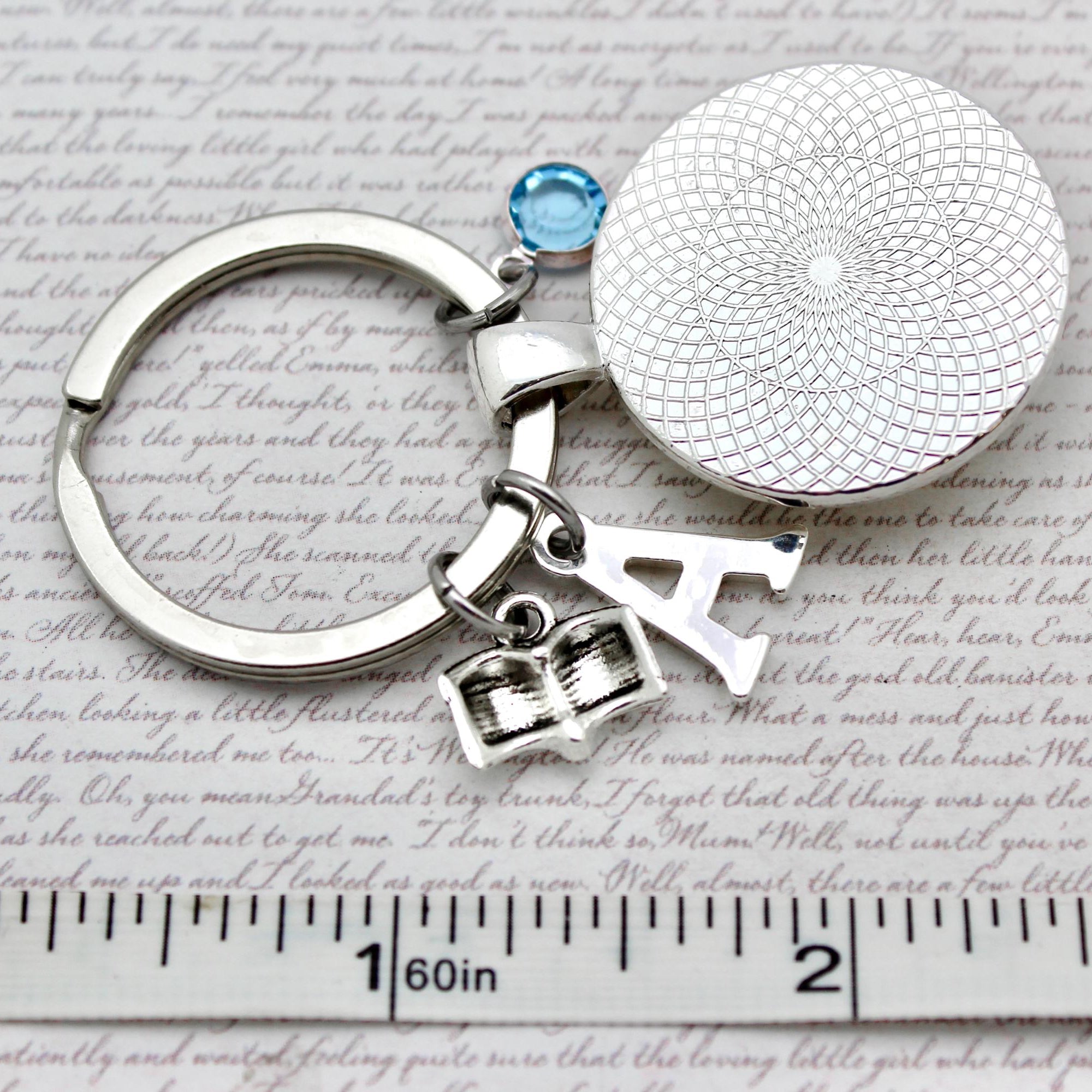 Keychain with round silver charm and  pendant 