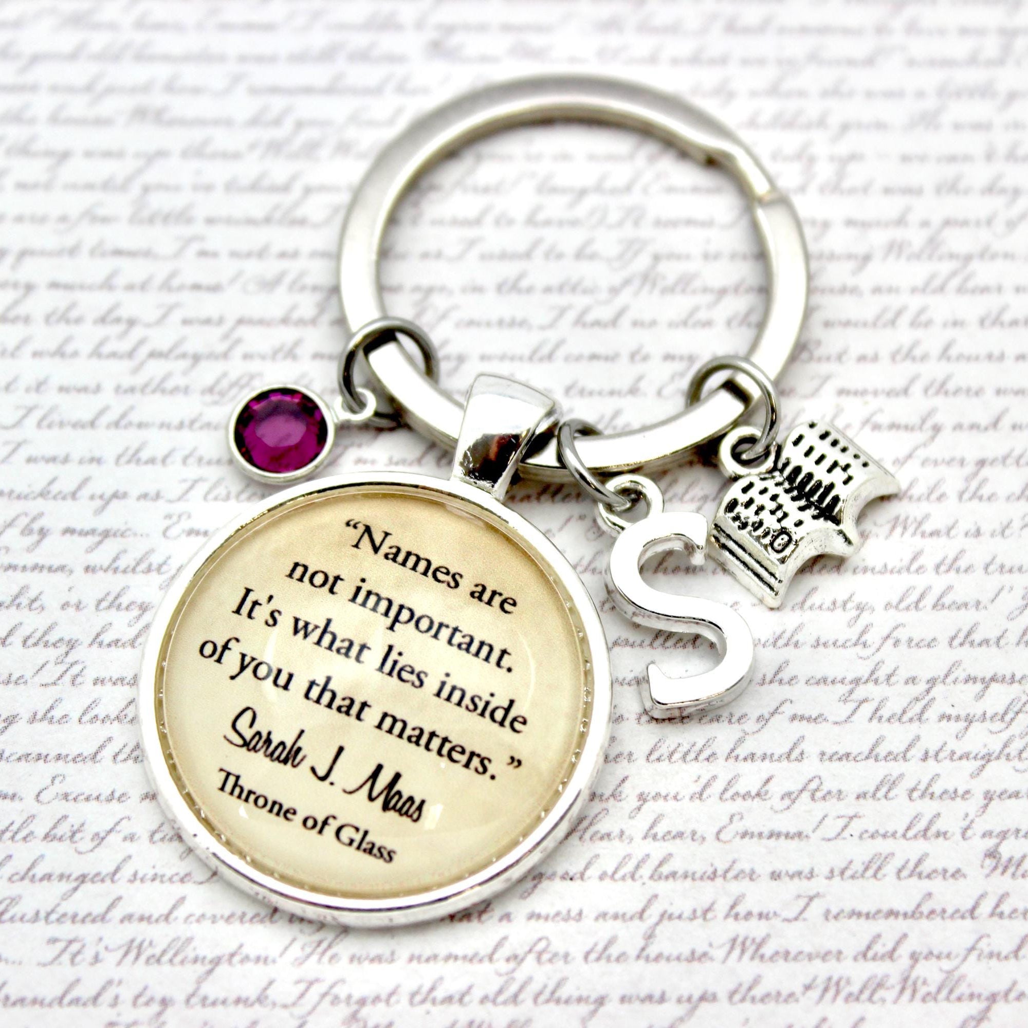 Keychain with a quote charm on a textured background