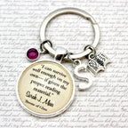 Keychain with a quote charm on a white background with text