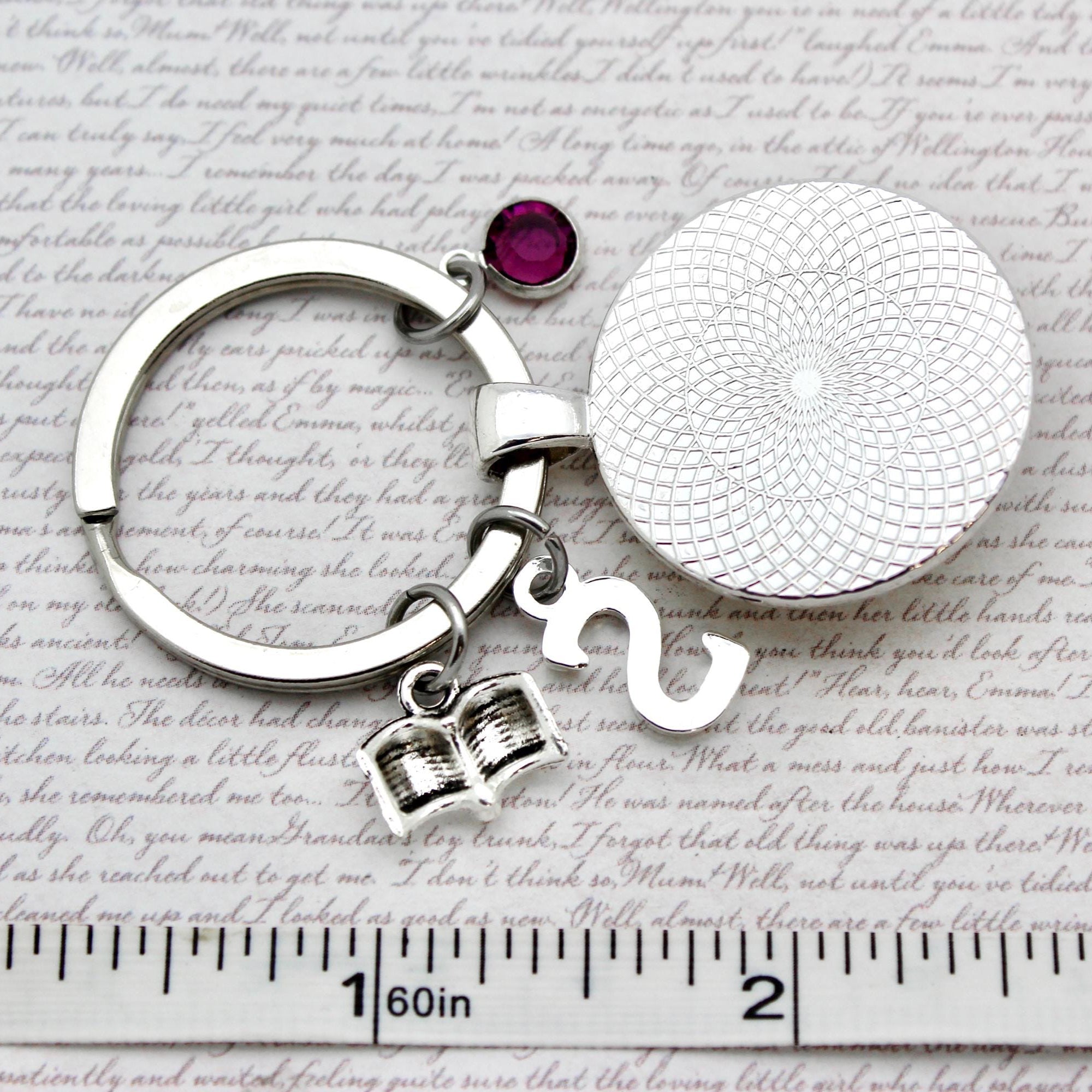 Keychain with round silver charm and gemstone 